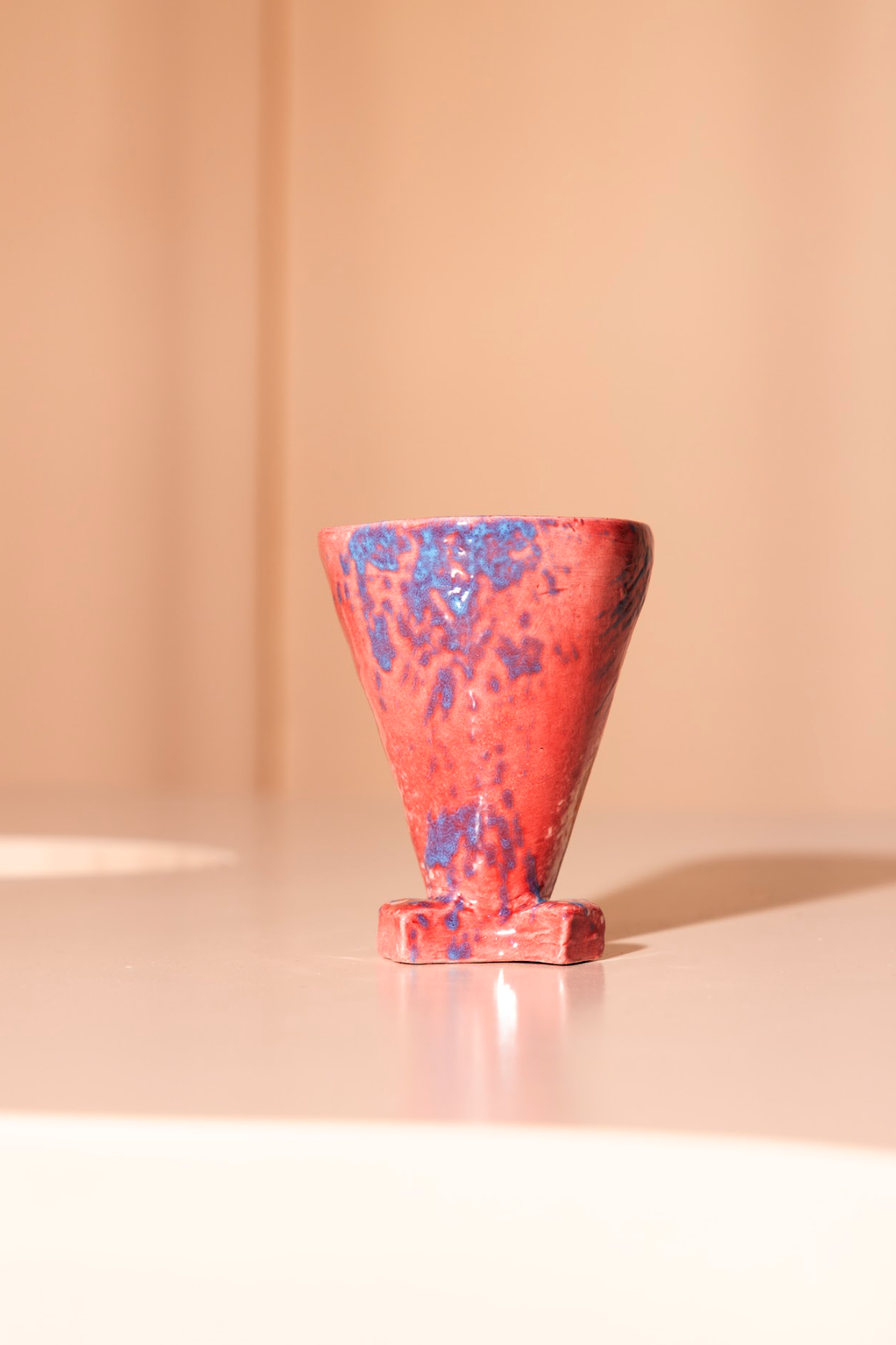 Handmade ceramics cup with pink/lightblue glazing