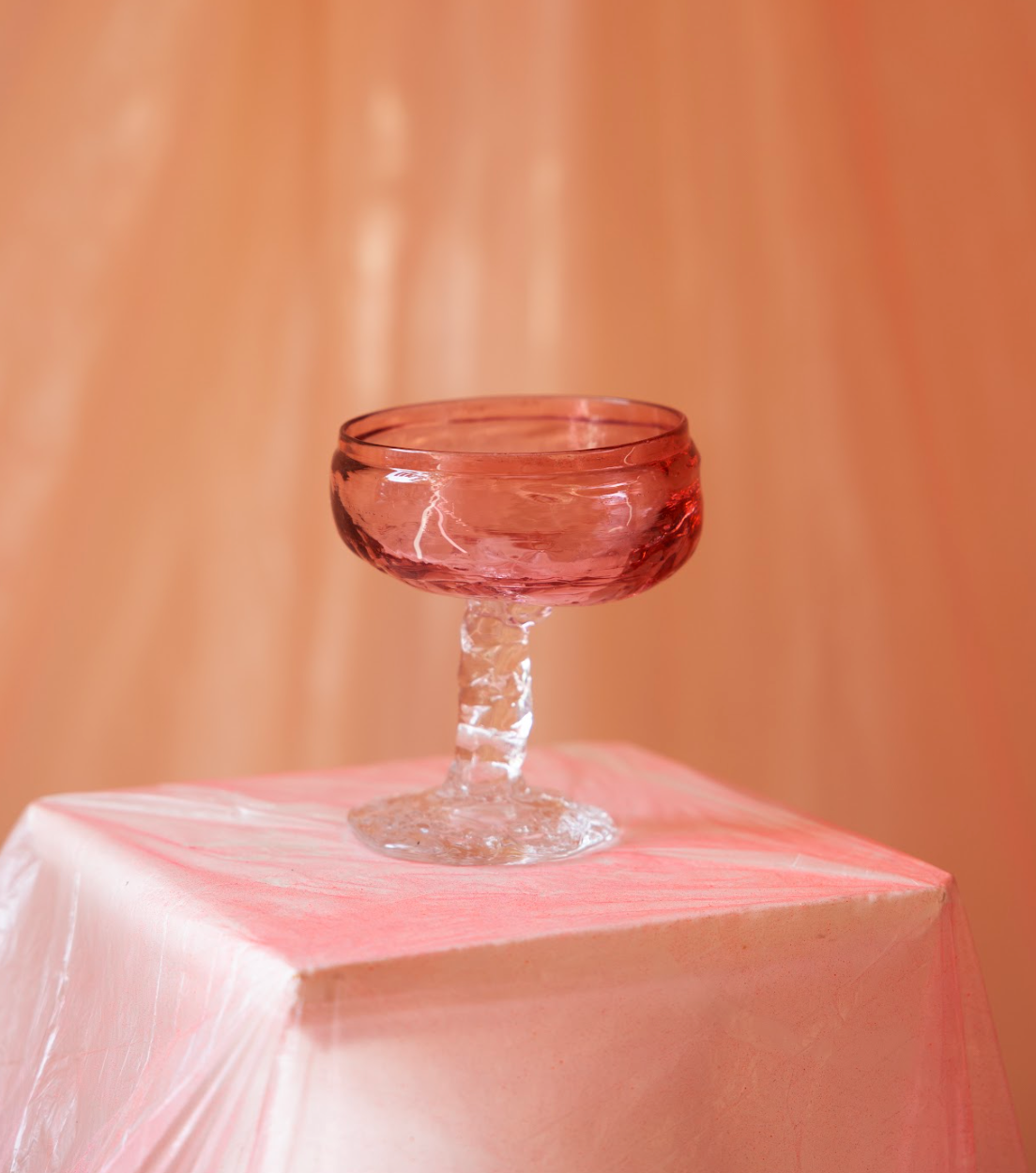 Champagne coupe, pink/red, by Bernard