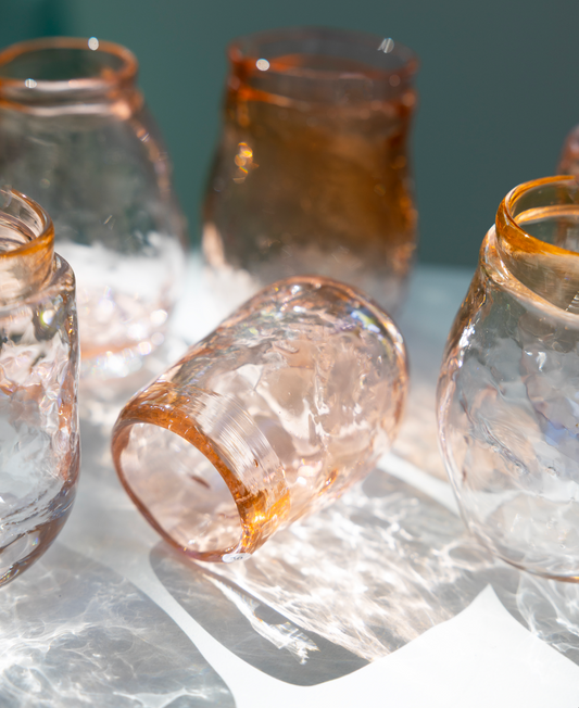 water glass, shades of pink/oranje, by Bernard